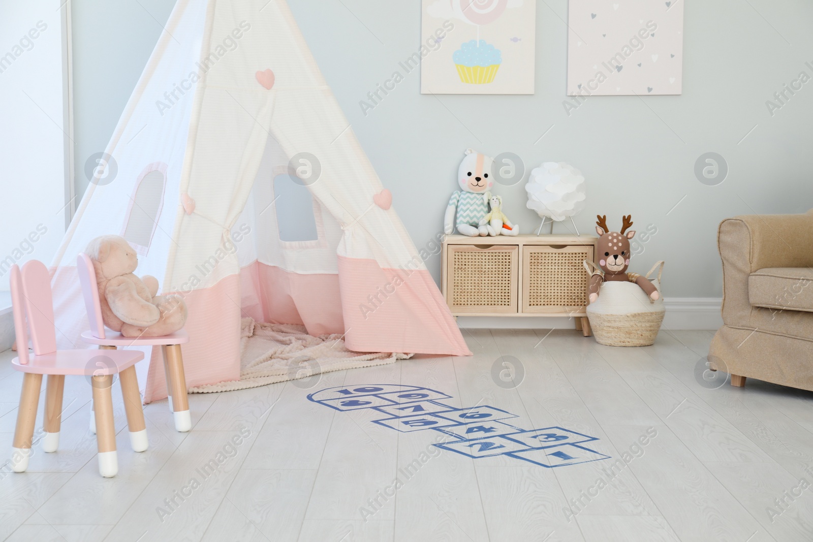 Photo of Beautiful child's room with blue hopscotch floor sticker