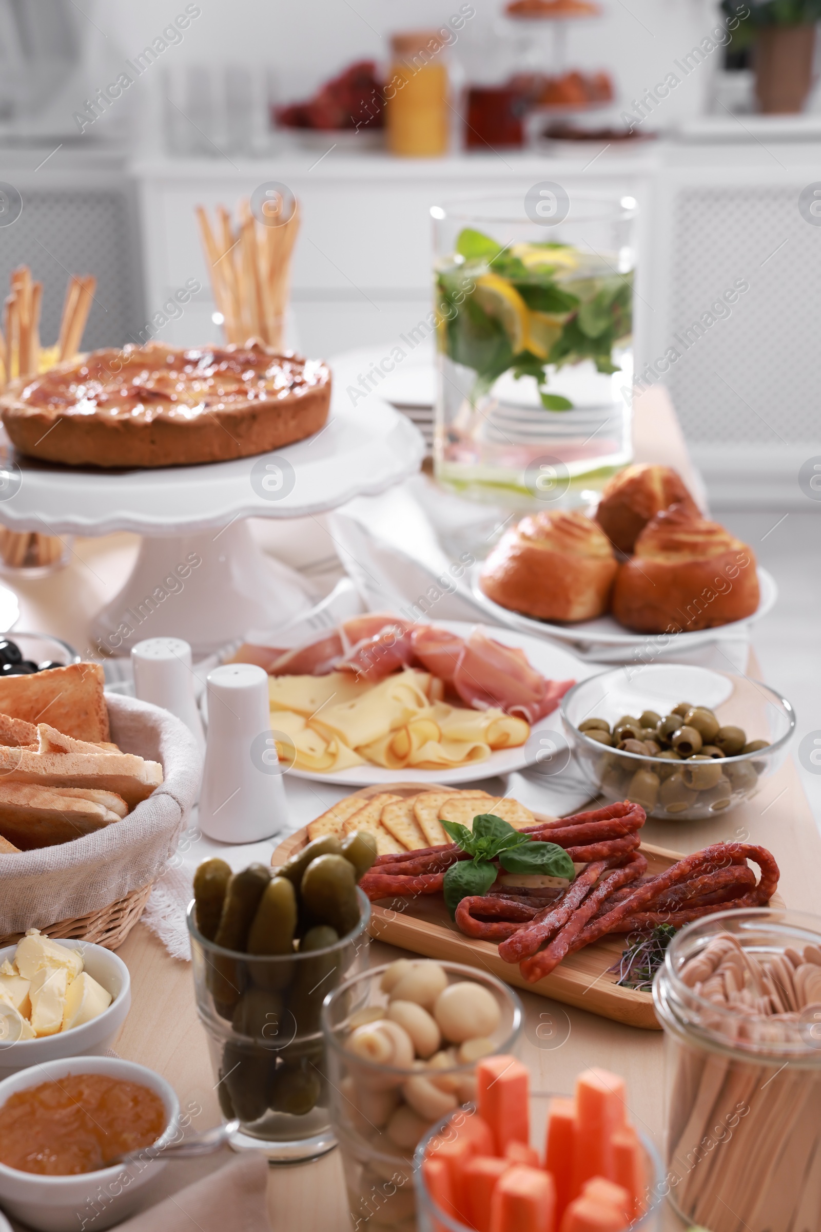 Photo of Dishes with different food on table in room. Luxury brunch