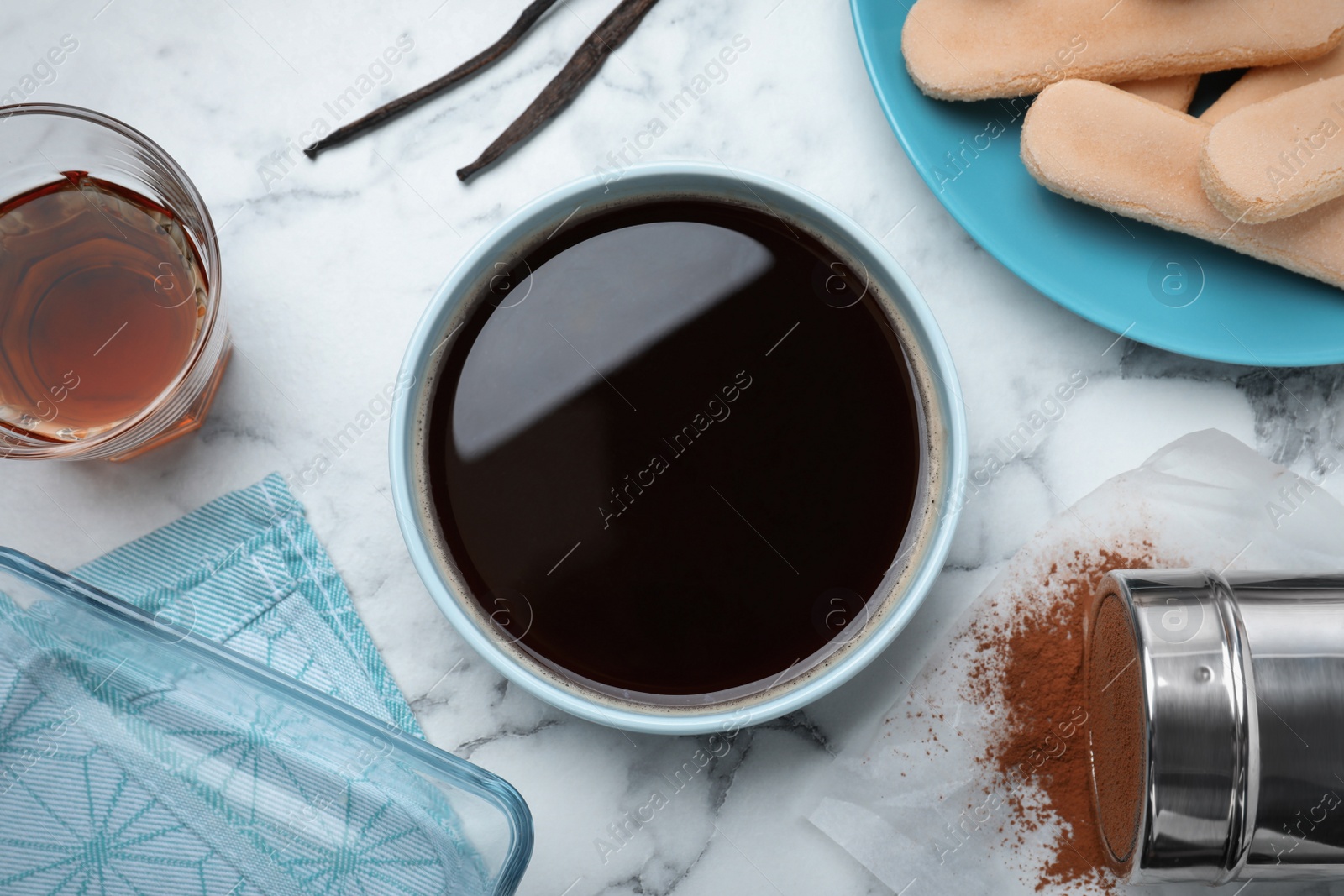 Photo of Flat lay composition with coffee and other tiramisu ingredients on white marble table