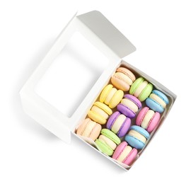 Photo of Many delicious colorful macarons in box on white background, top view