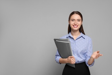 Photo of Portrait of beautiful young teacher on grey background. Space for text