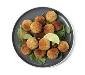 Photo of Delicious falafel balls with lime on white background, top view