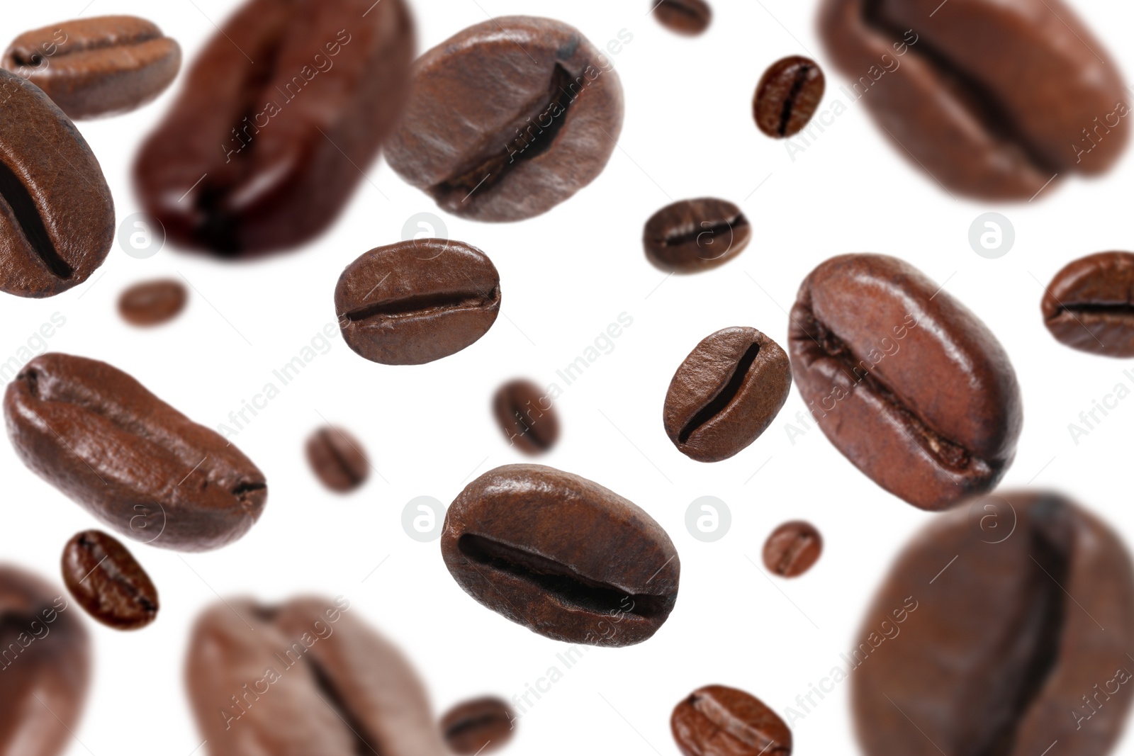 Image of Roasted coffee beans falling o white background