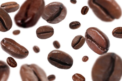 Image of Roasted coffee beans falling o white background