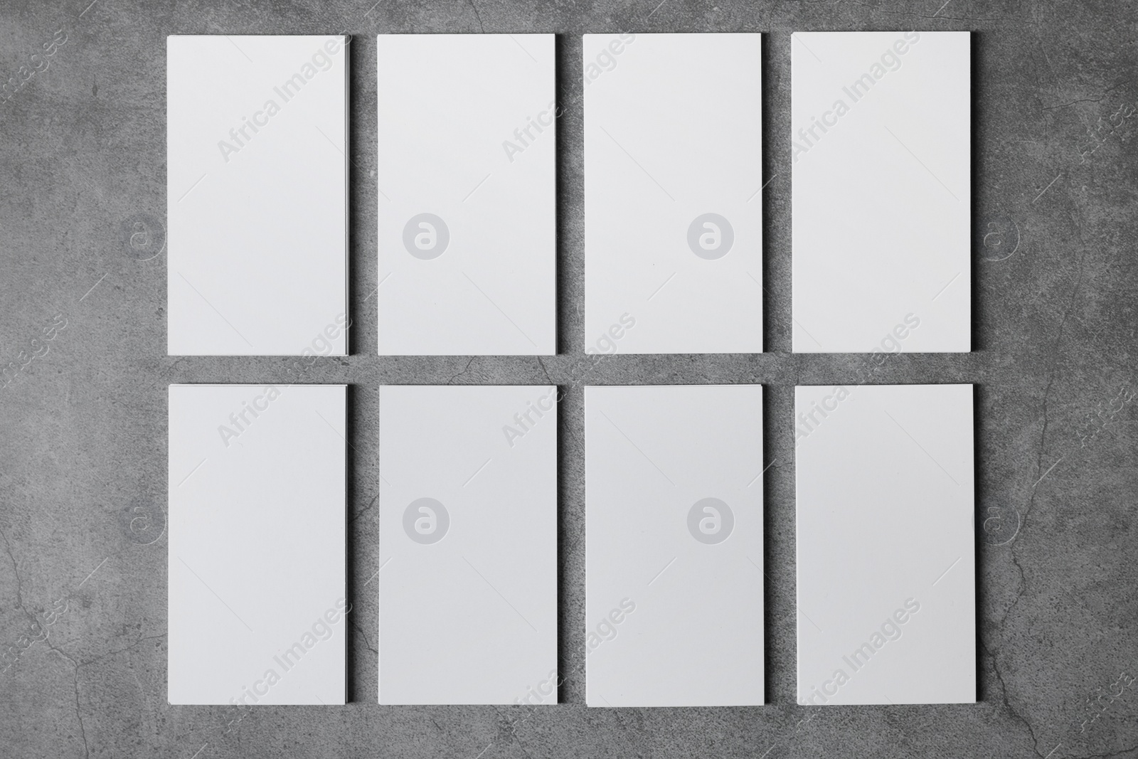 Photo of Blank business cards on grey textured background, top view. Mockup for design