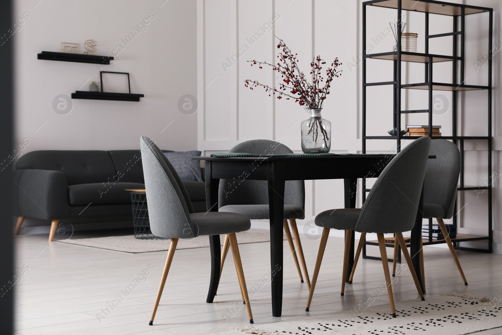 Photo of Beautiful dining room interior with new stylish furniture