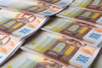Photo of 50 Euro banknotes as background, closeup. Money exchange