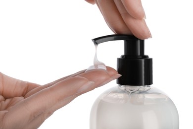 Woman using liquid soap dispenser on white background, closeup