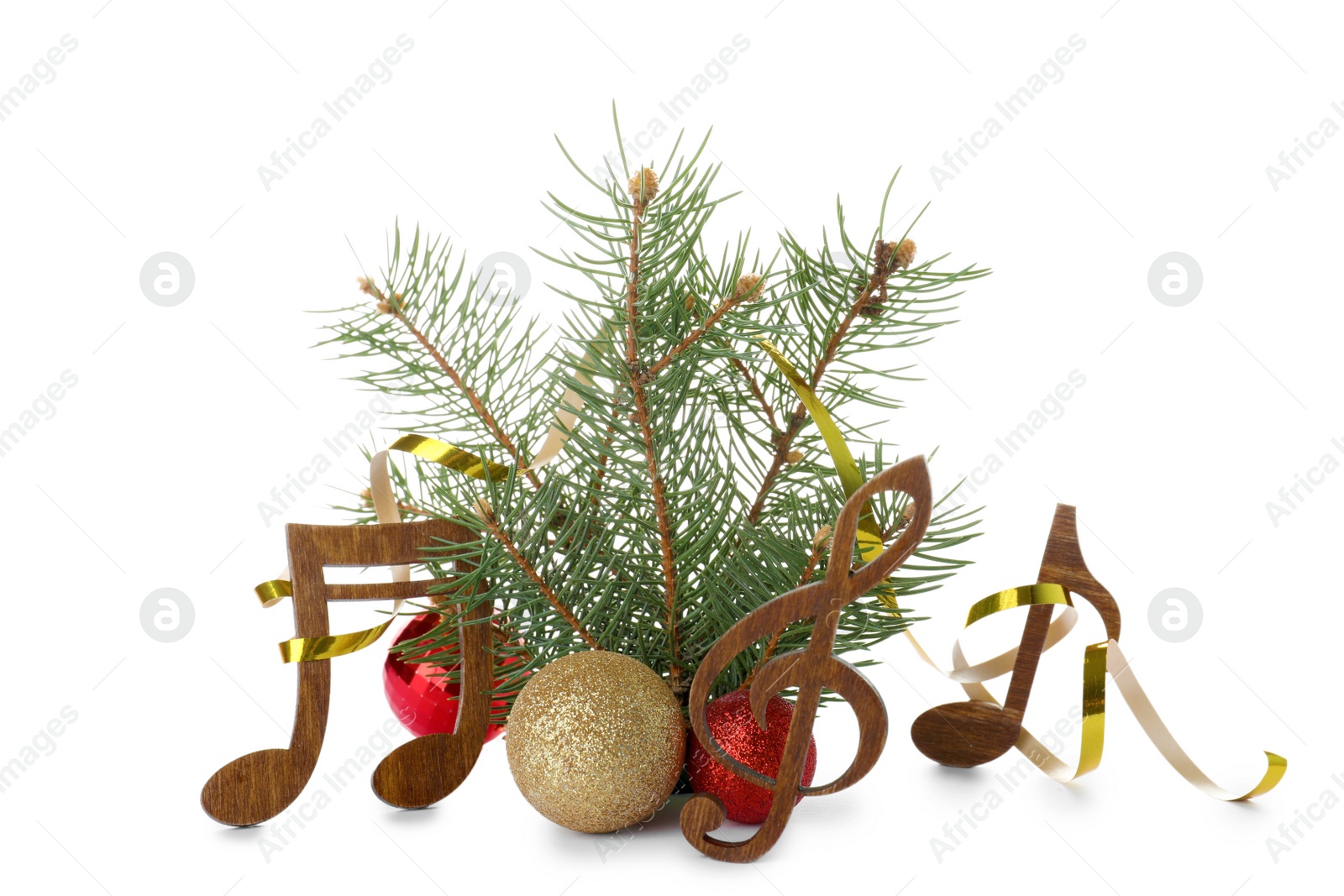 Photo of Composition with Christmas tree branch, decor and wooden music notes on white background