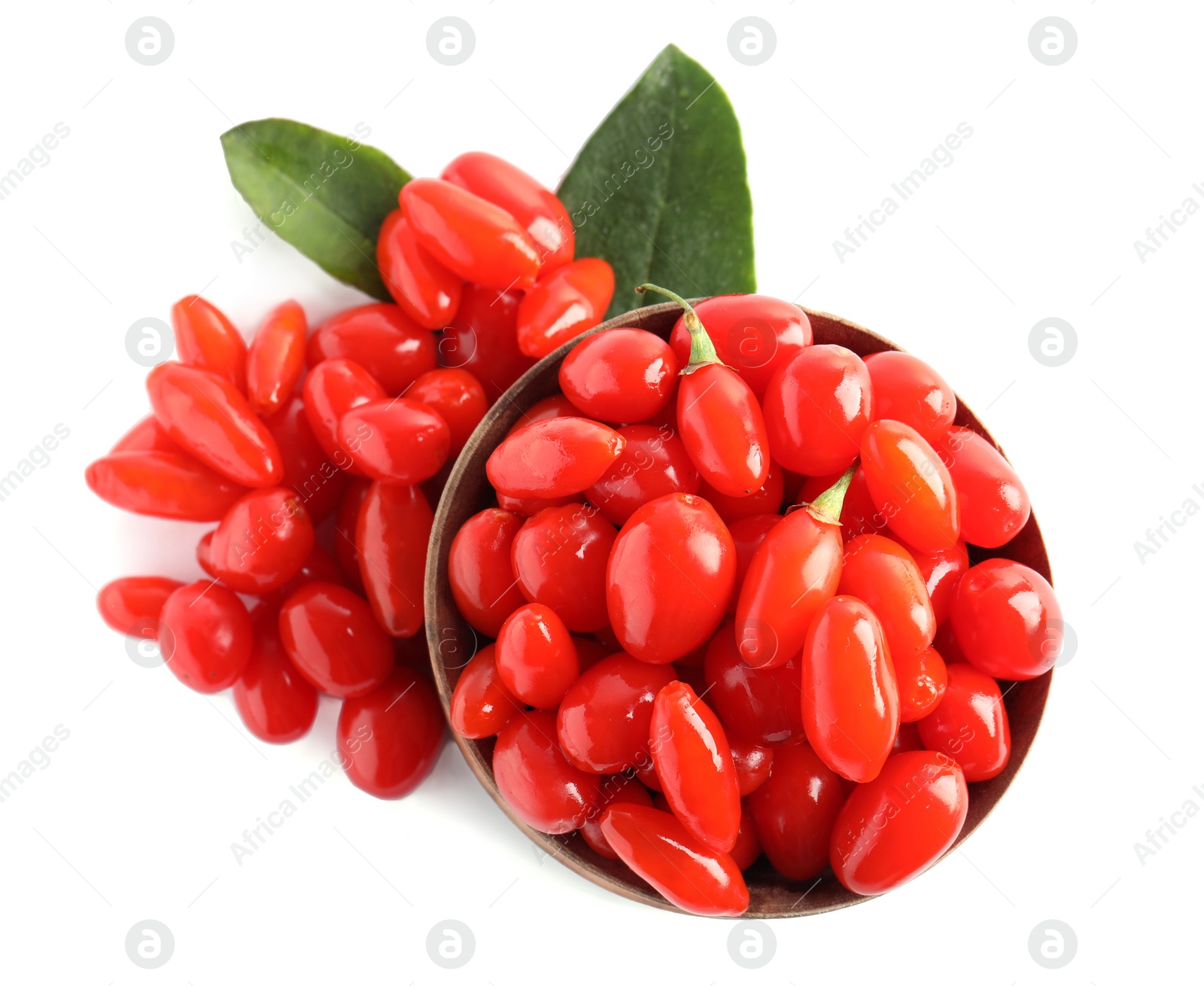 Photo of Fresh ripe goji berries and wooden bowl on white background, top view