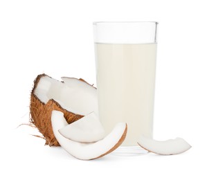 Glass of coconut water and nuts isolated on white