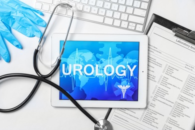 Flat lay composition with tablet, stethoscope and test form on light background. Urology concept