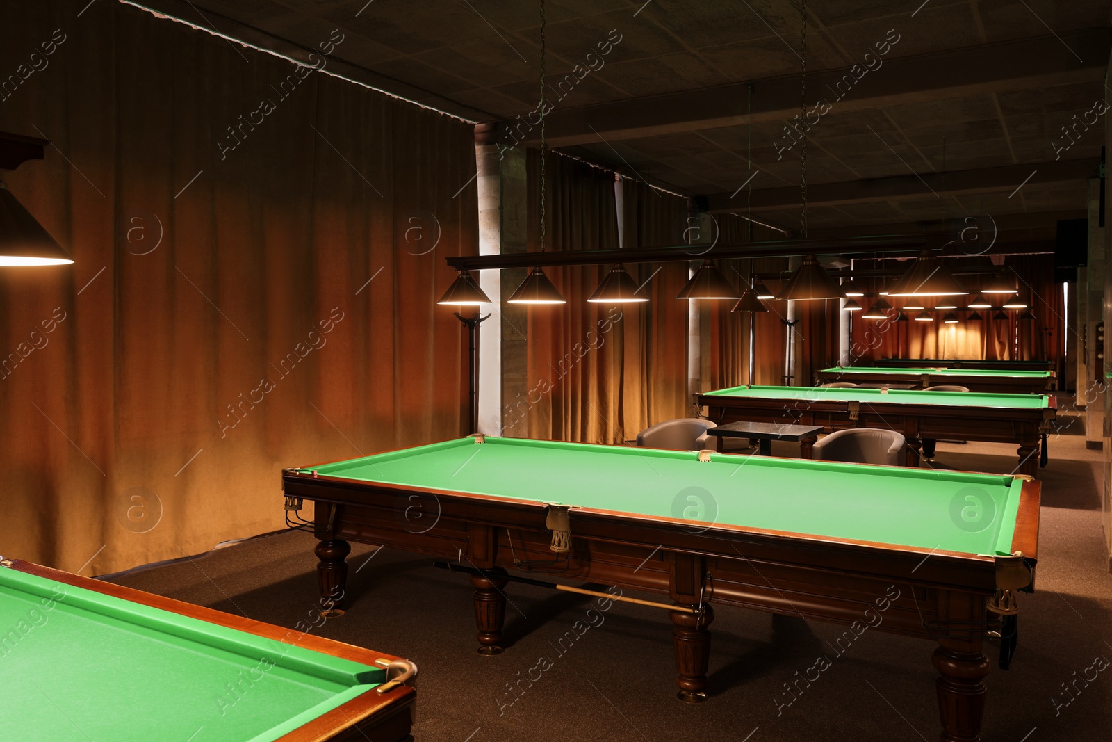 Photo of Empty green billiard tables in club. Pool Game
