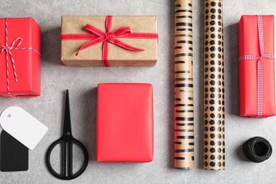 Photo of Flat lay composition with gift boxes on grey background