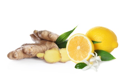 Fresh ginger root and lemon on white background