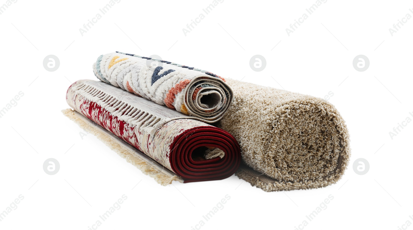 Photo of Rolled carpets on white background. Interior element