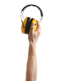 Photo of Man holding protective headphones on white background. Construction tools