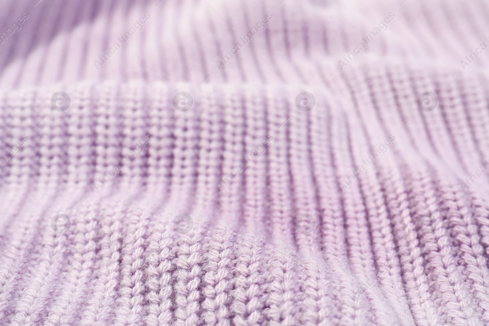Photo of Texture of cozy warm sweater as background, closeup