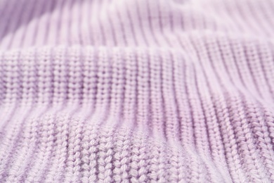 Texture of cozy warm sweater as background, closeup