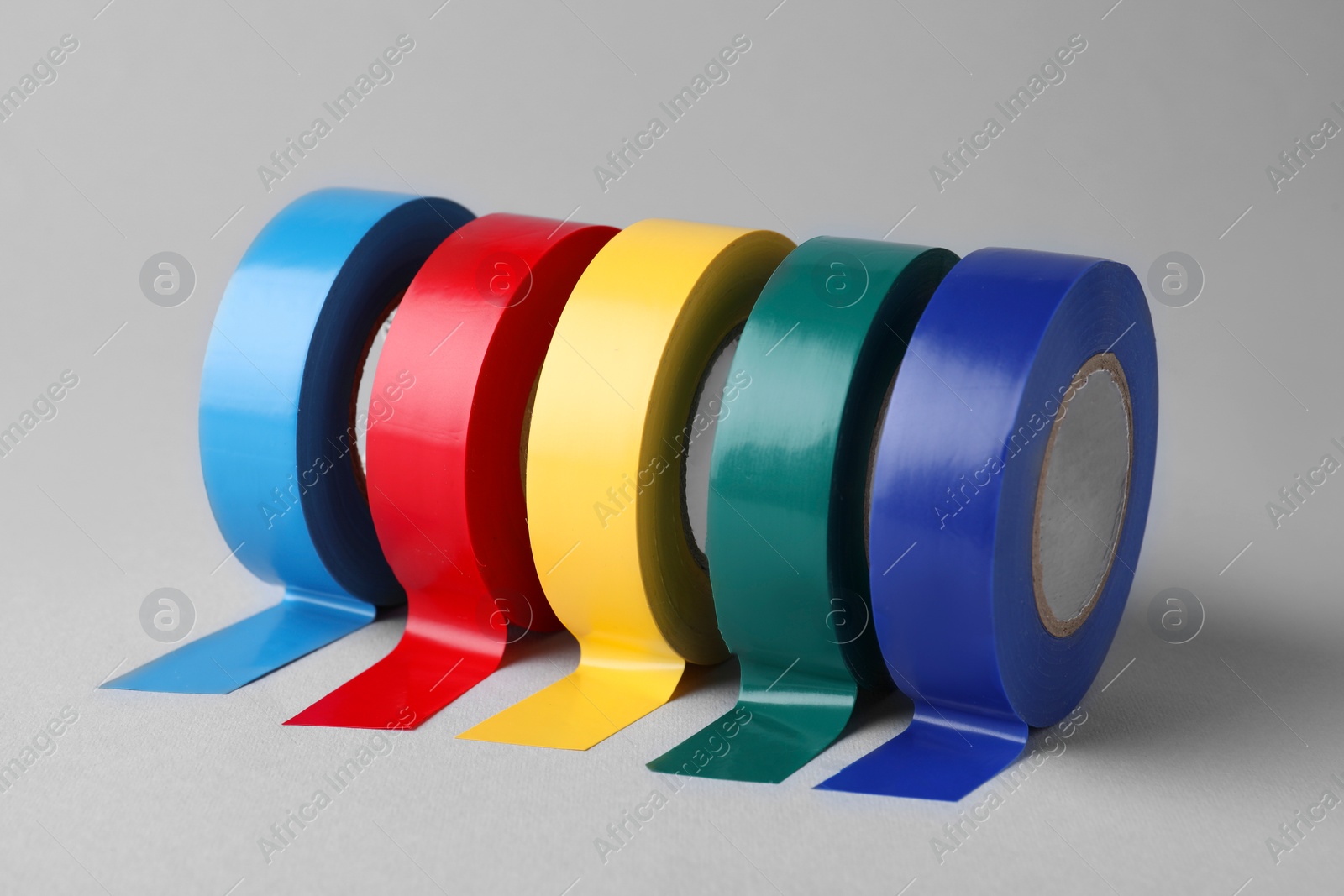 Photo of Colorful insulating tapes on white background. Electrician's supplies