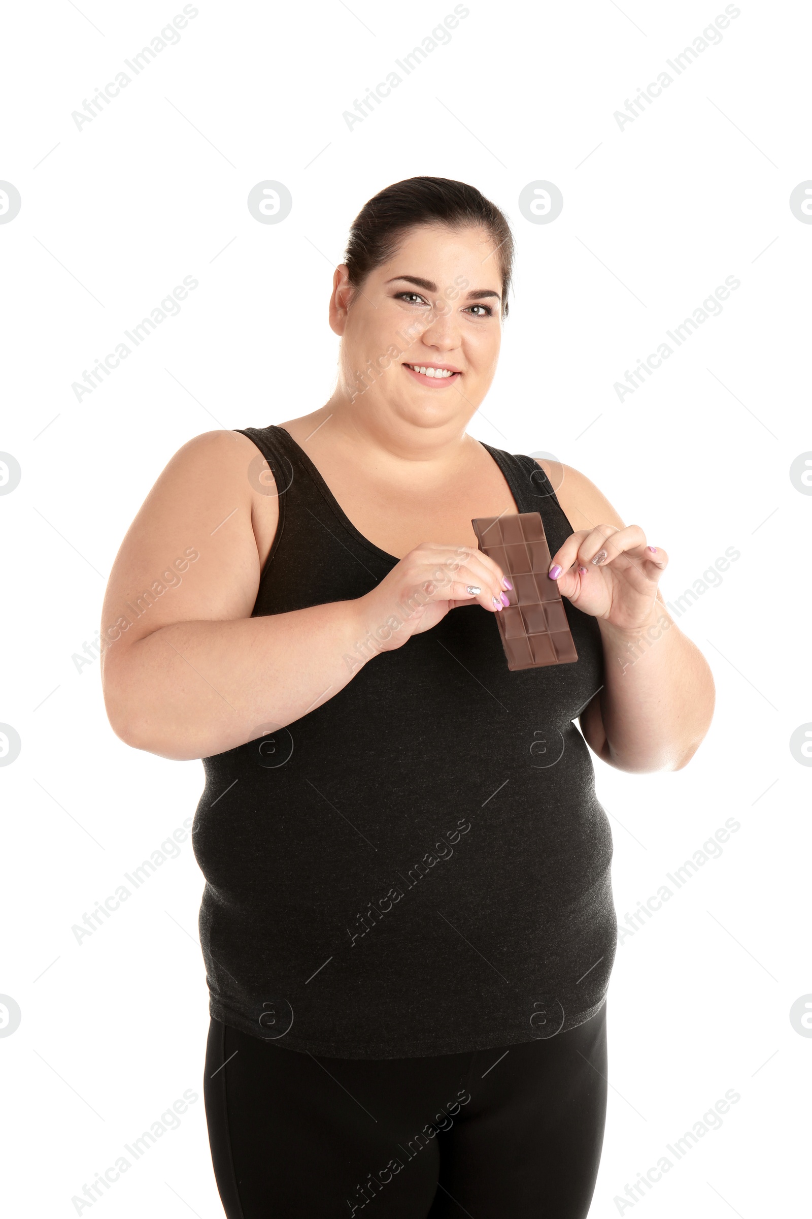 Photo of Overweight woman with chocolate bar on white background