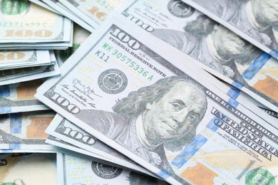 Photo of Dollar banknotes as background, closeup view. Money exchange