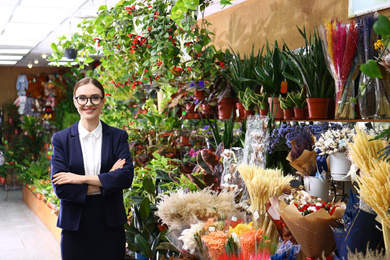 Photo of Portrait of female business owner in flower shop
