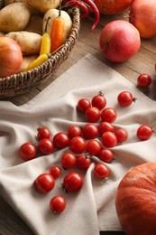 Photo of Different fresh ripe vegetables, berries and fruits on wooden table. Farmer produce