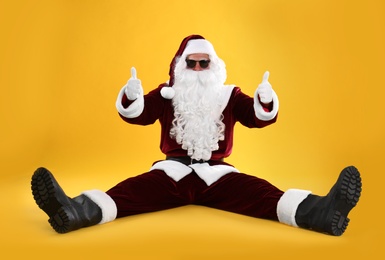 Santa Claus with sunglasses on yellow background