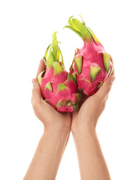 Photo of Woman holding ripe dragon fruits (pitahaya) on white background, closeup