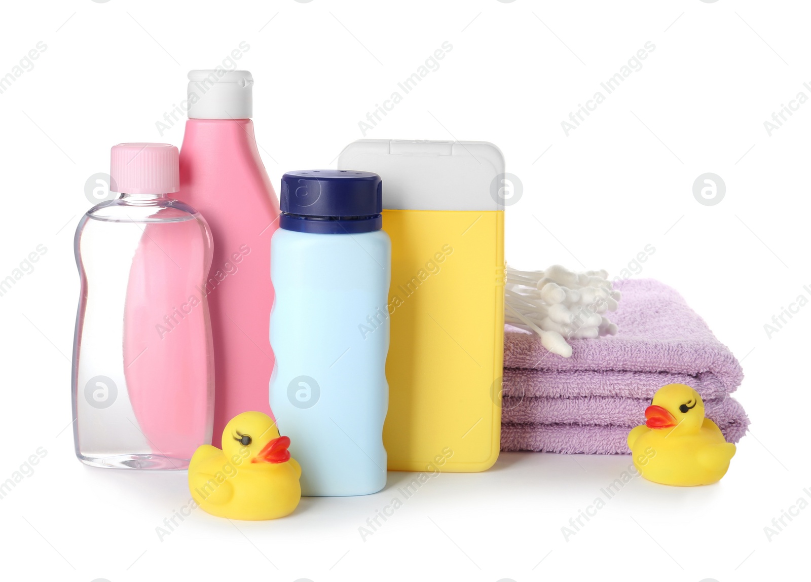 Photo of Bottles of baby cosmetic products, towels, cotton swabs and rubber ducks on white background