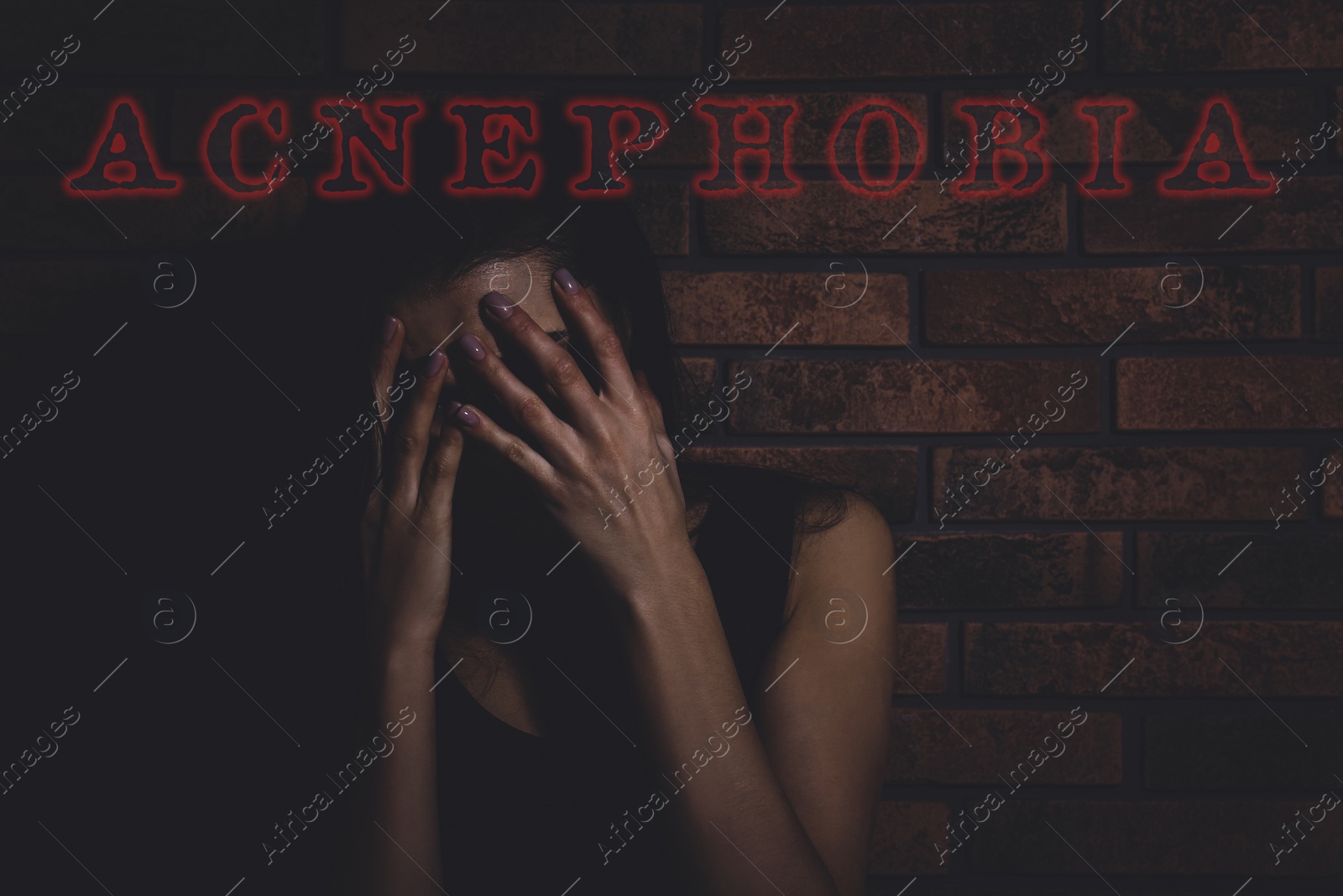 Image of Acnephobia concept. Scared woman hiding face in darkness