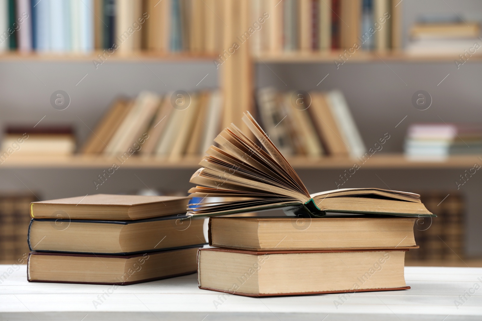 Photo of Many books on white table in library