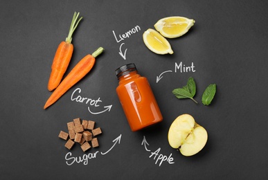 Photo of Bottle of carrot juice, different ingredients and written product's names on black background, flat lay
