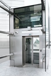 Photo of Modern large and silver inclusive elevator on street