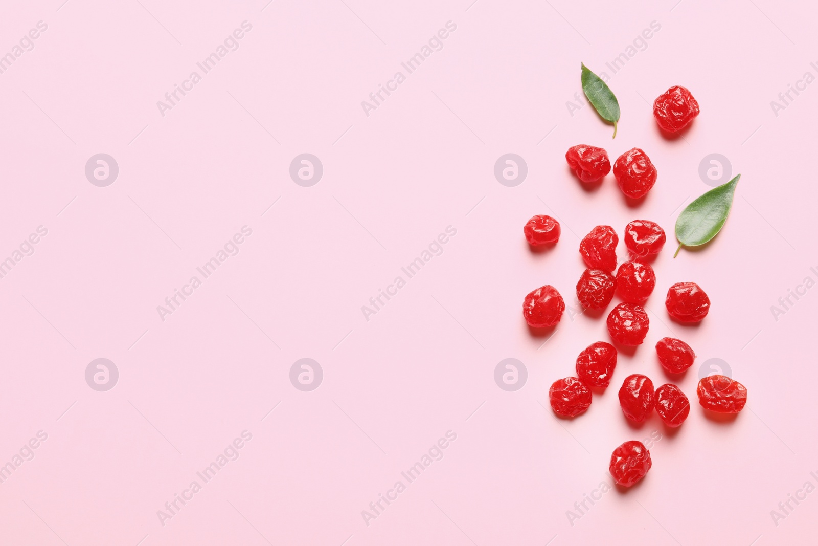 Photo of Cherries on color background, top view with space for text. Dried fruit as healthy snack