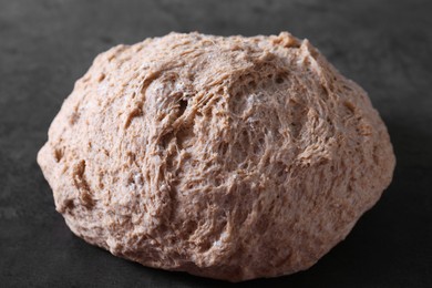 Photo of Fresh sourdough on grey table, closeup view