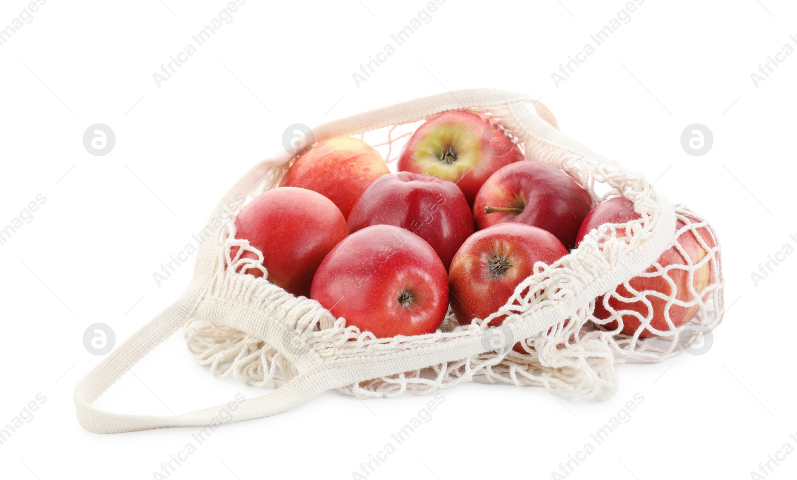 Photo of String bag with apples isolated on white