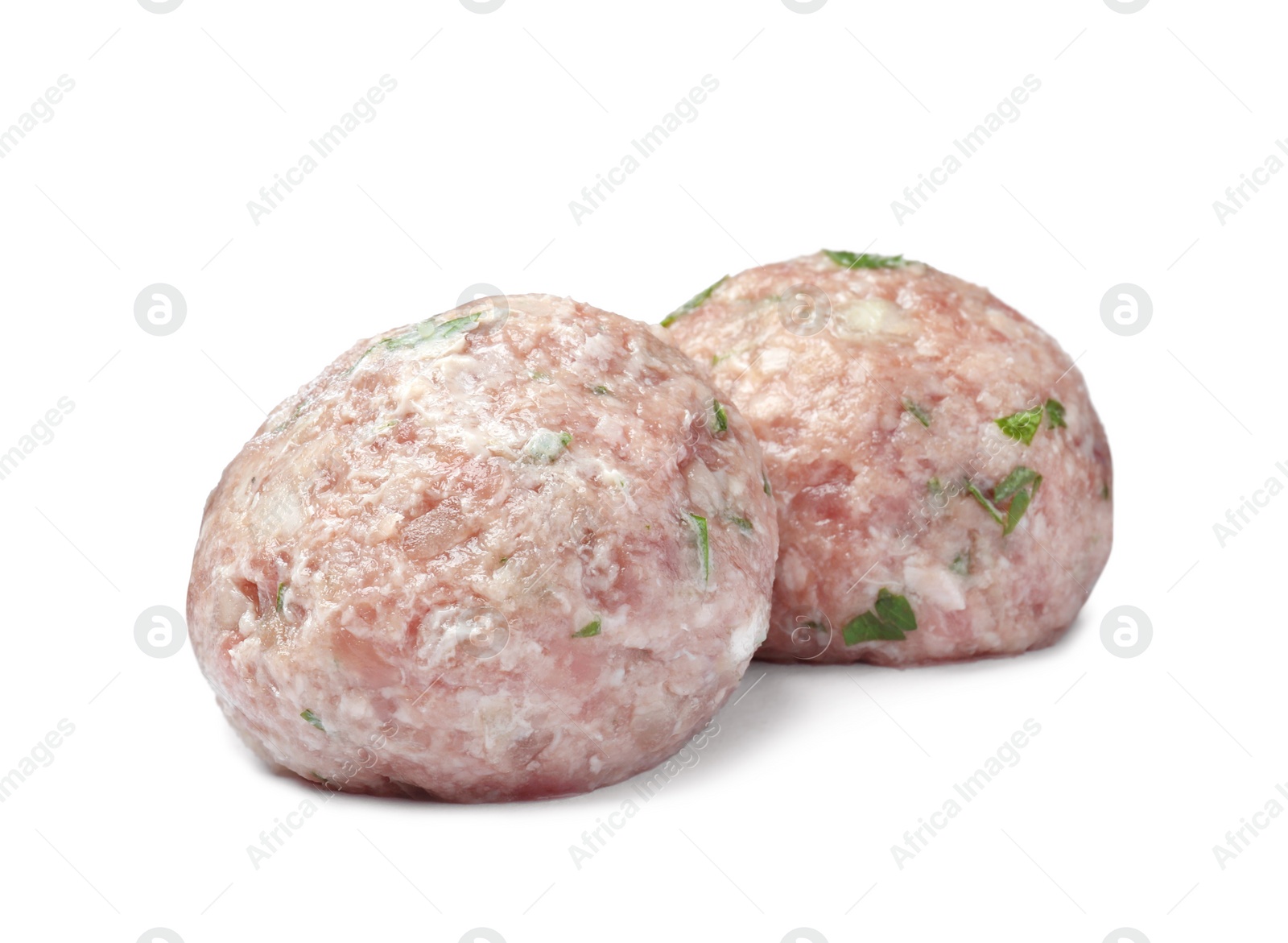 Photo of Two fresh raw meatballs isolated on white