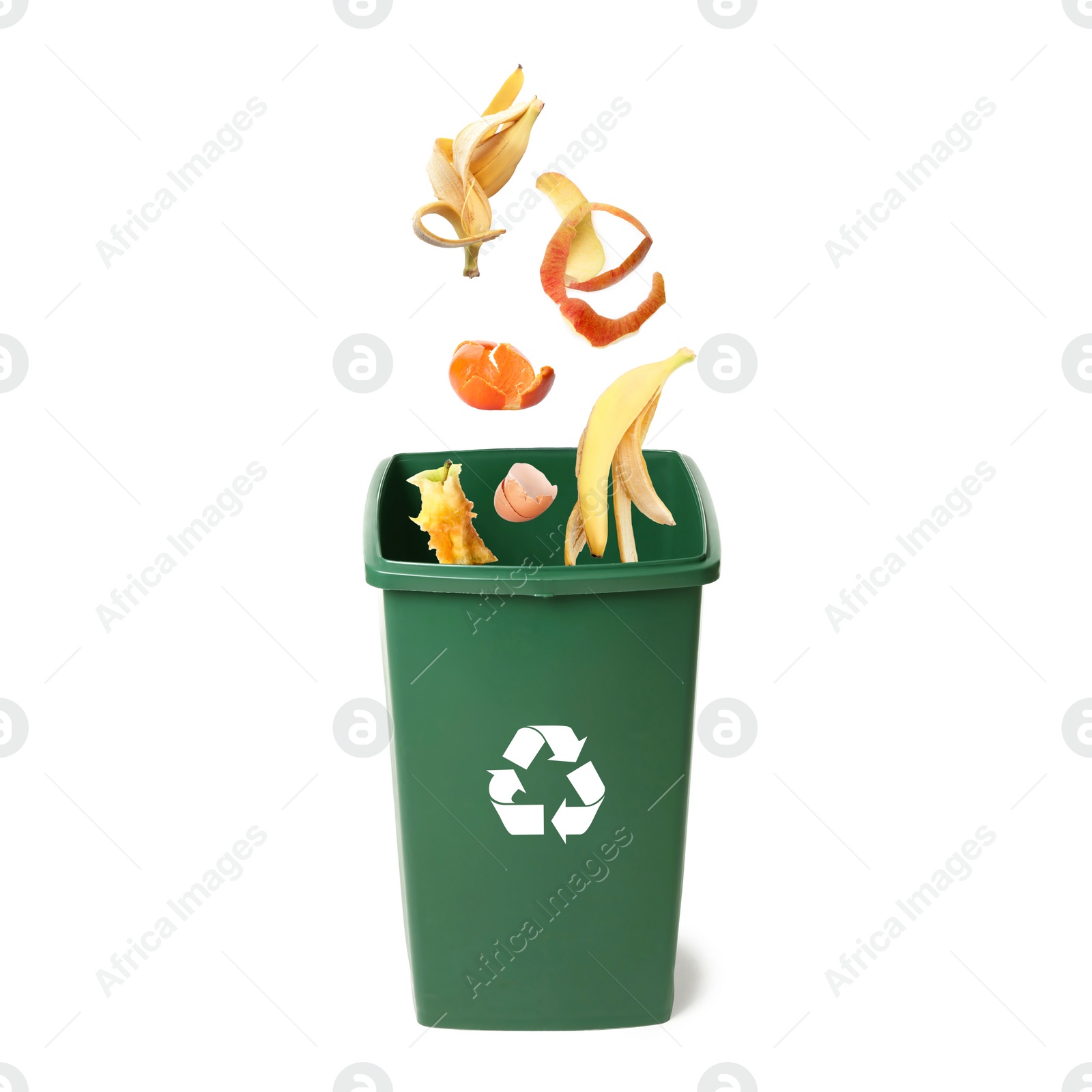 Image of Garbage falling into trash bin on white background