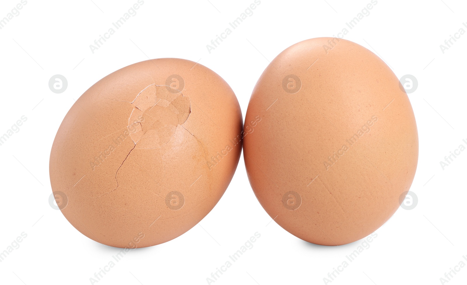 Photo of Whole and cracked chicken eggs isolated on white