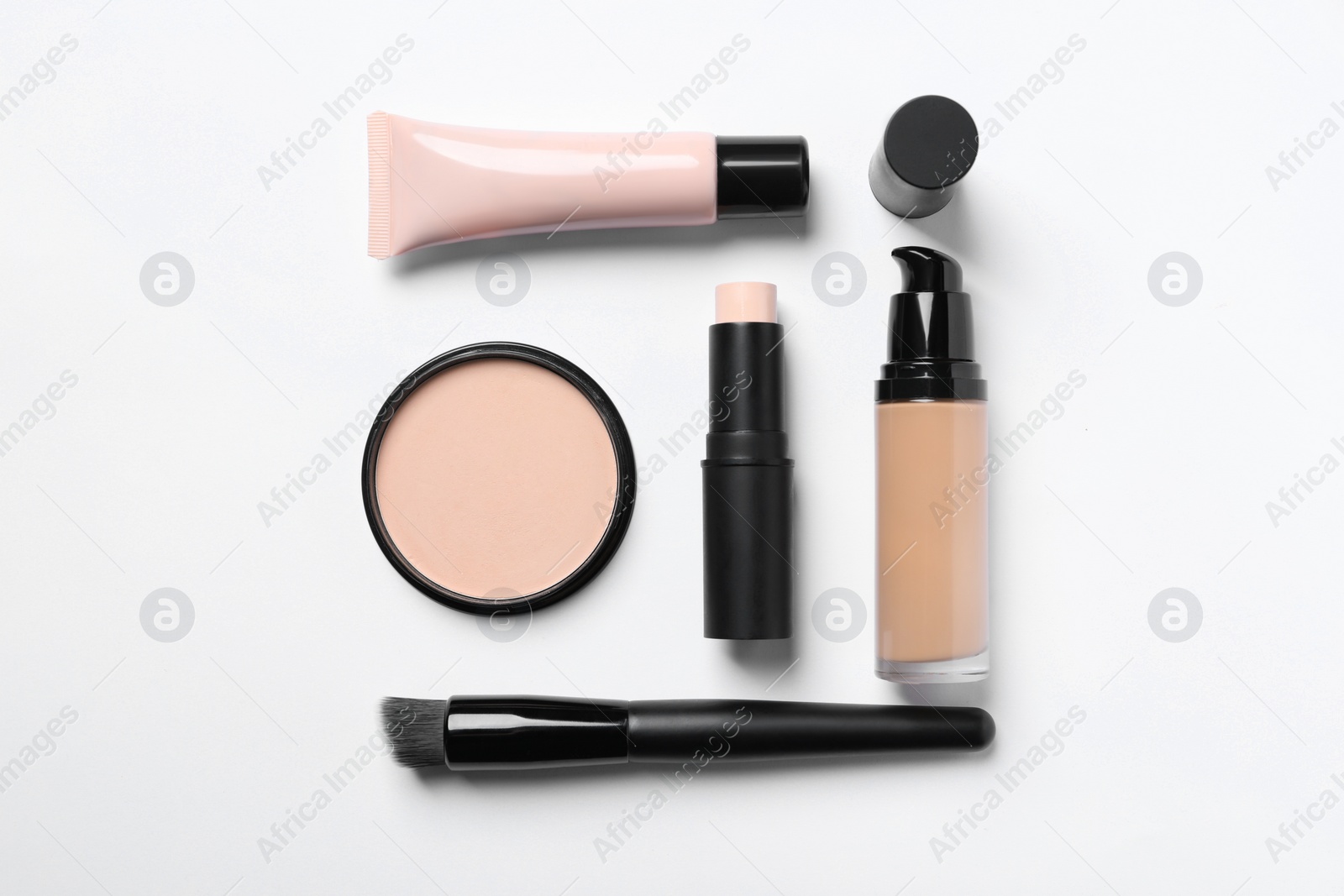 Photo of Different types of skin foundation on white background, flat lay. Makeup product