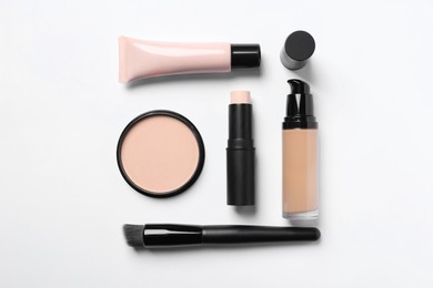 Different types of skin foundation on white background, flat lay. Makeup product