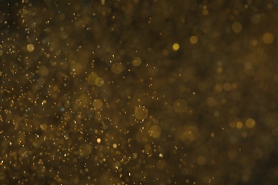 Magic golden bokeh effect on color background