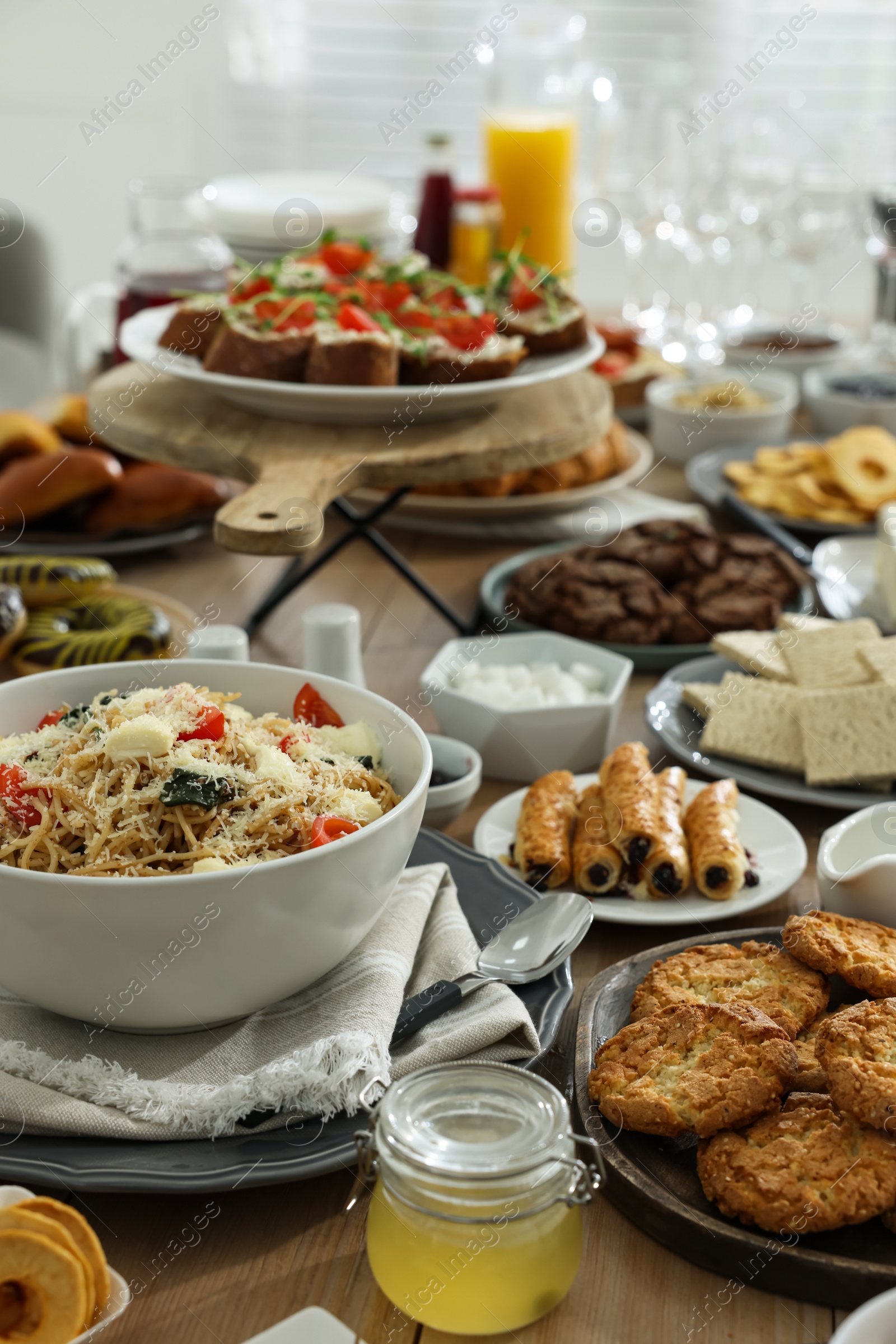 Photo of Brunch table setting with different delicious food indoors