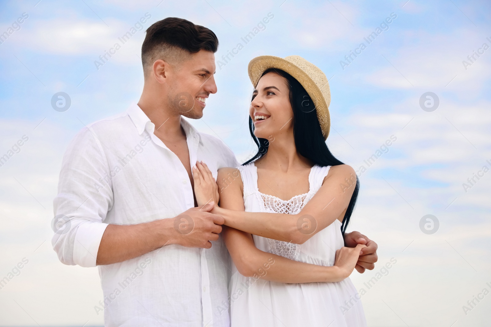 Photo of Happy young couple dancing outdoors in summer