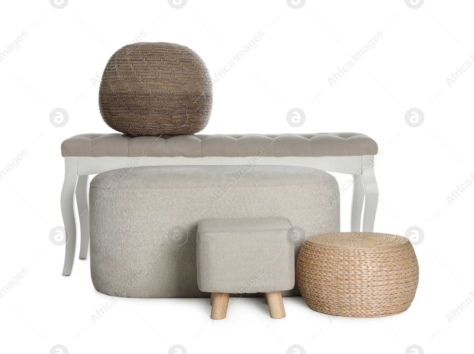 Photo of Different poufs and bench on white background. Home design