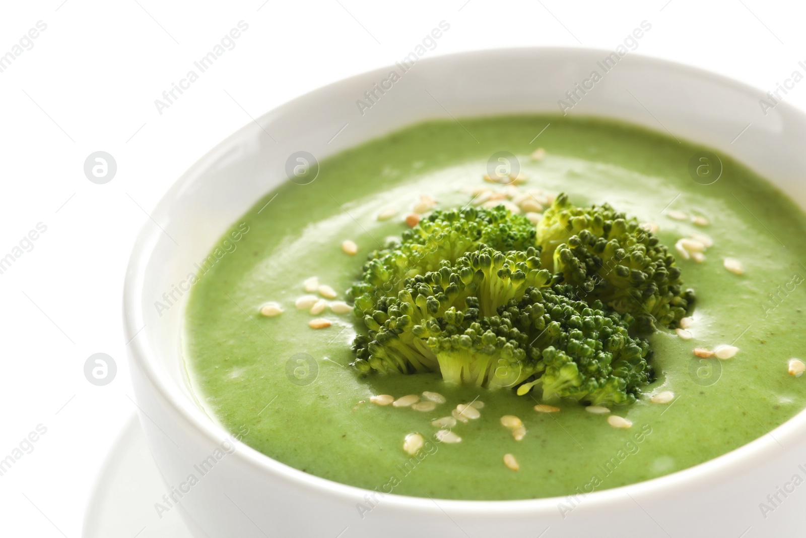 Photo of Fresh vegetable detox soup made of broccoli in dish on white background, closeup