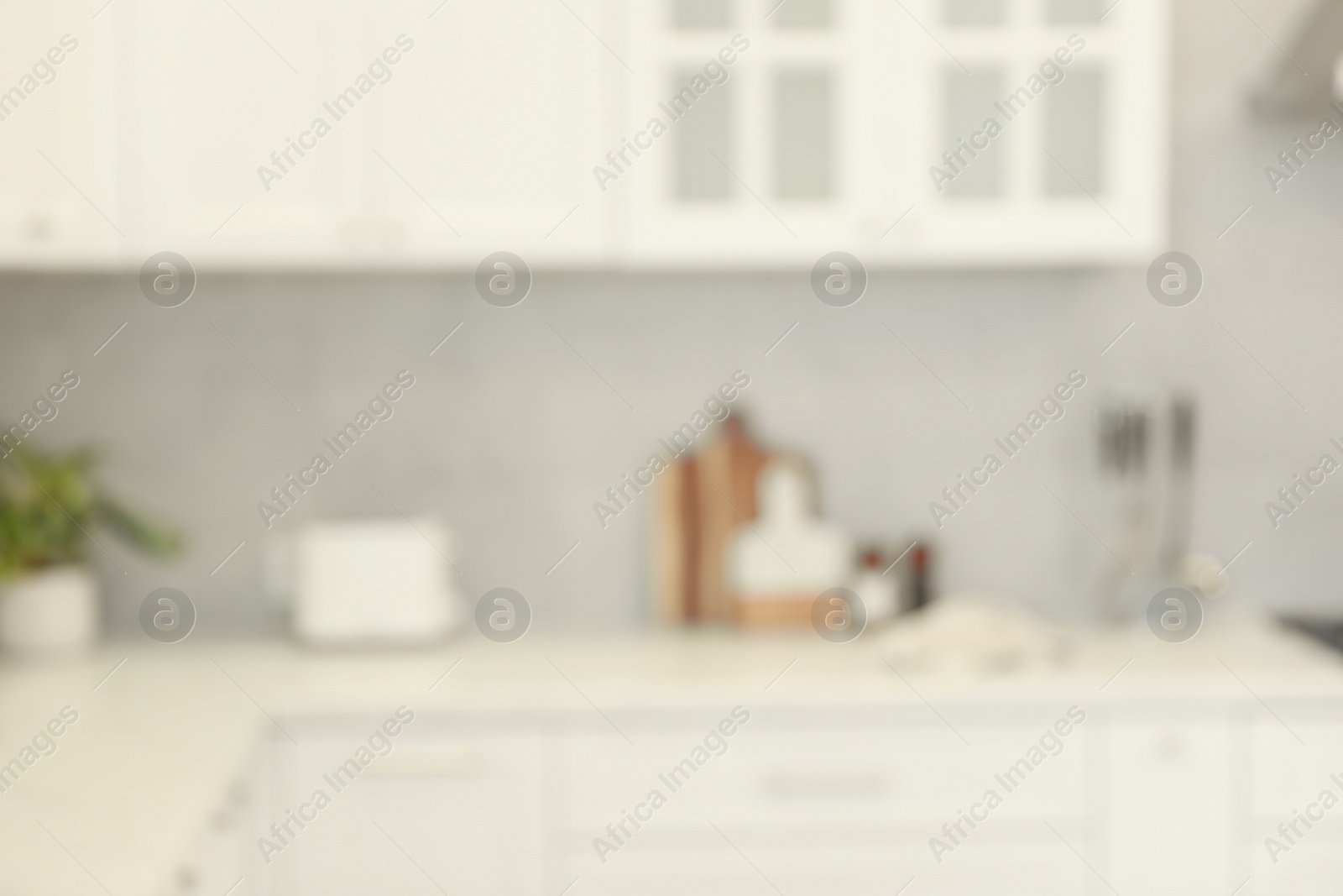 Photo of Blurred view of modern kitchen. Interior design