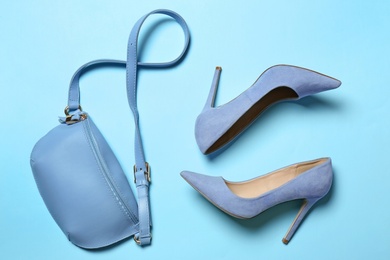 Photo of Flat lay composition with lady's shoes and bag on color background